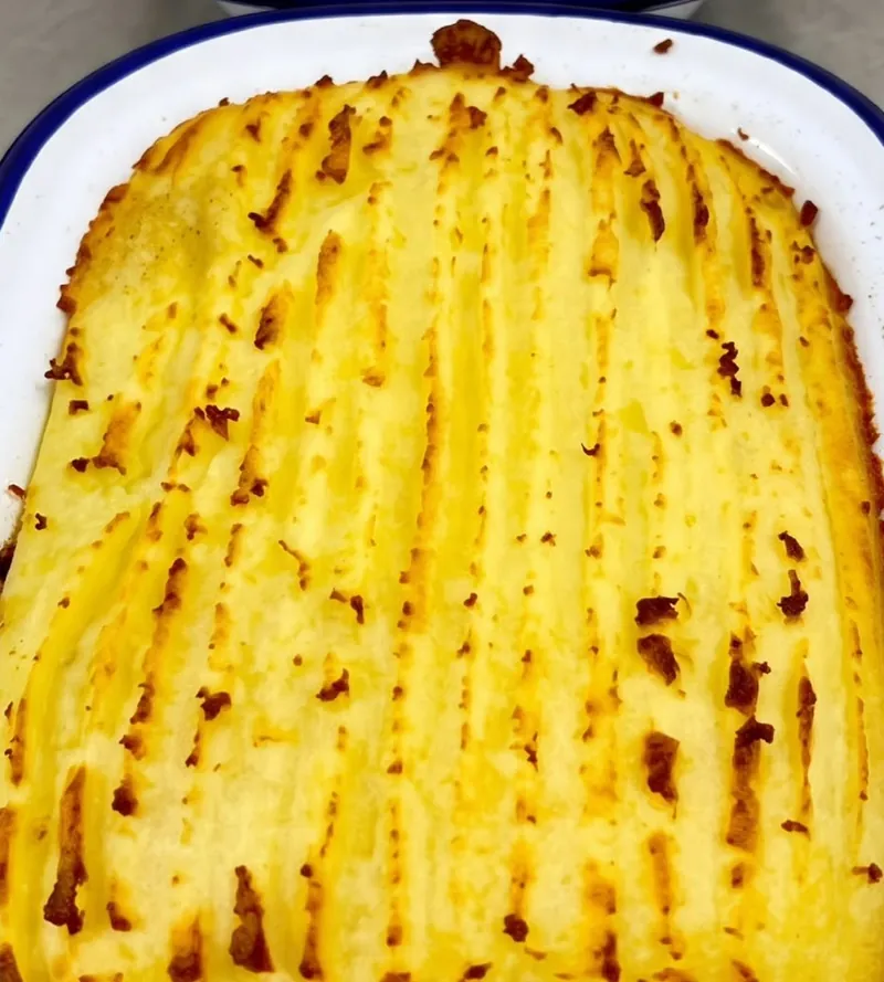 A tray of cottage pie with golden mash, fresh from the oven