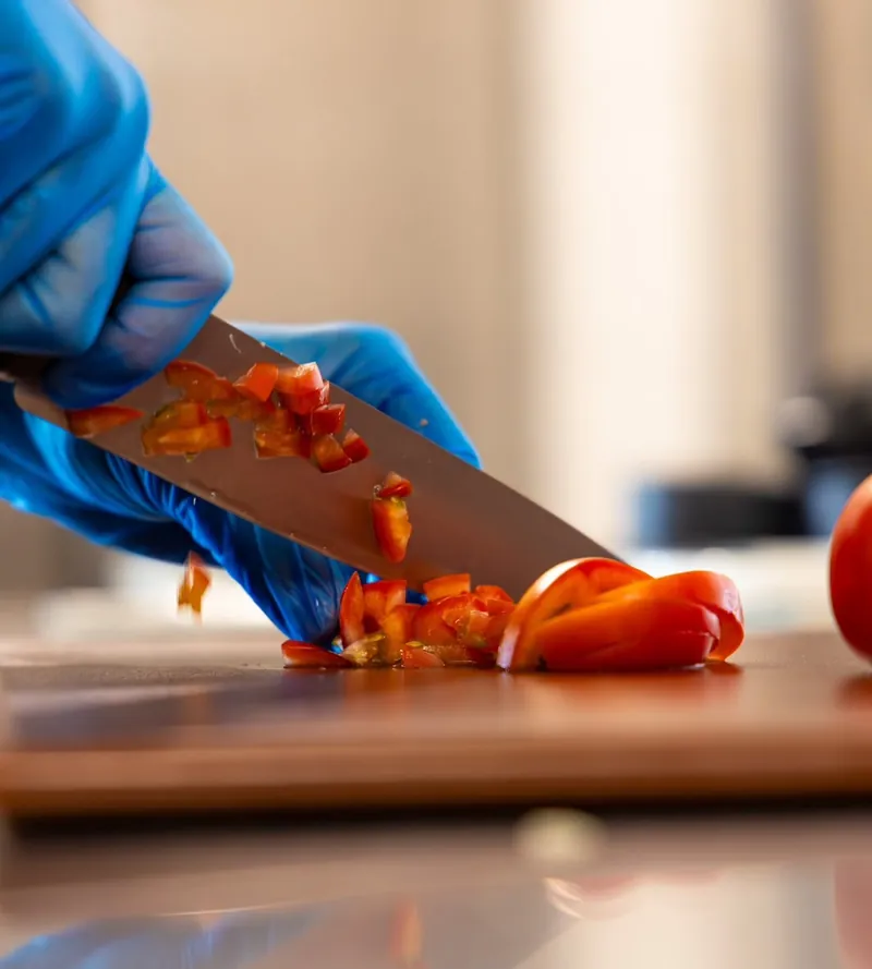 Tomatoes chopped by hand in the TNINE kitchen