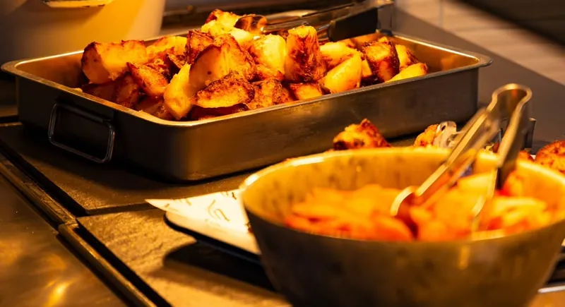 Roast potatoes and carrots on the TNINE hot counter