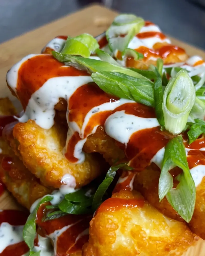 Halloumi fries with mint yoghurt, sriracha and spring onion