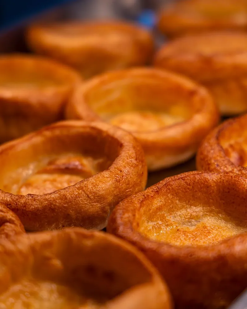 Golden Yorkshire puddings fresh from the oven